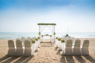 Picture of beach wedding chair rental set up in Miami, FL